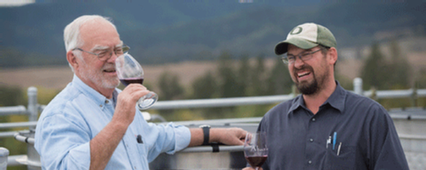 Earl and Andrew enjoying a moment together on the crush pad tasting wine